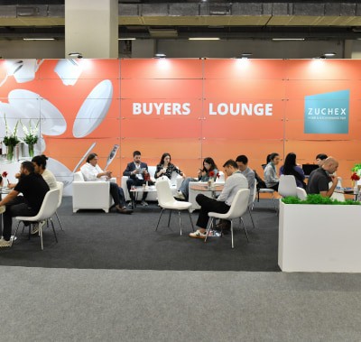 A group of buyers and visitors relaxing in the Buyers Lounge.